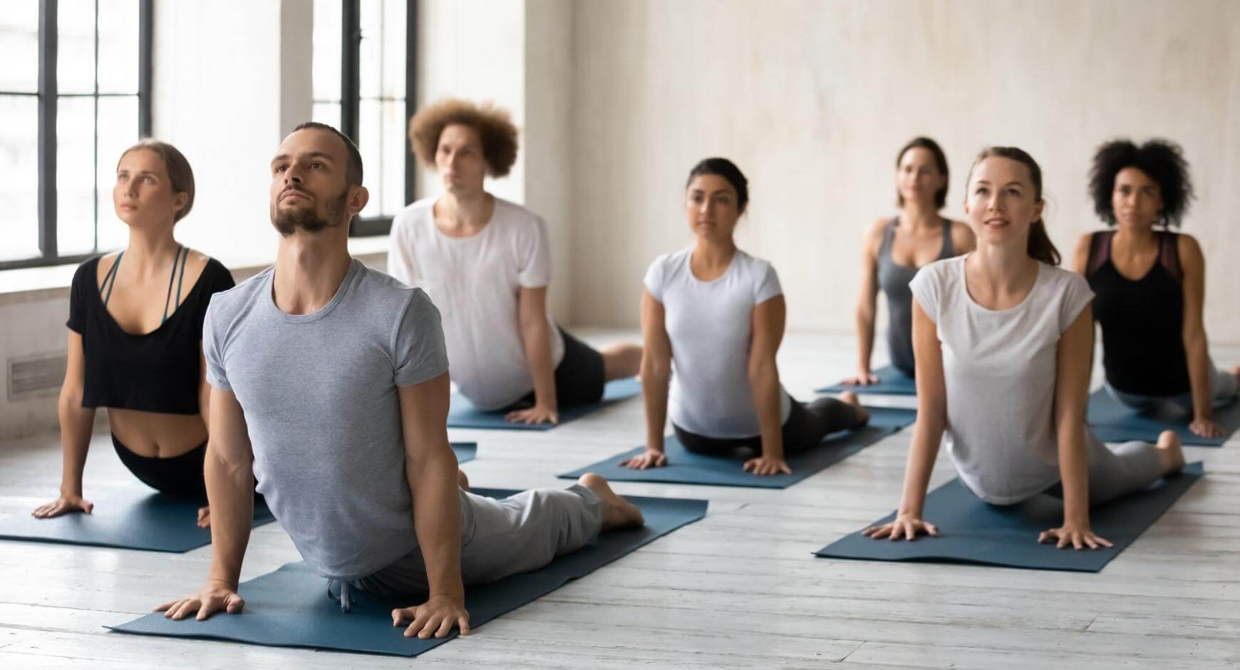 people participating in a yoga class