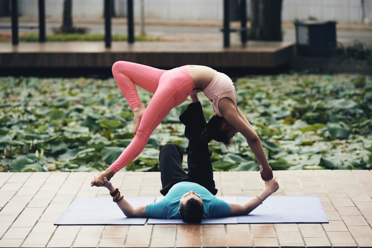 Premium Photo | Group of three people doing a crow yoga pose