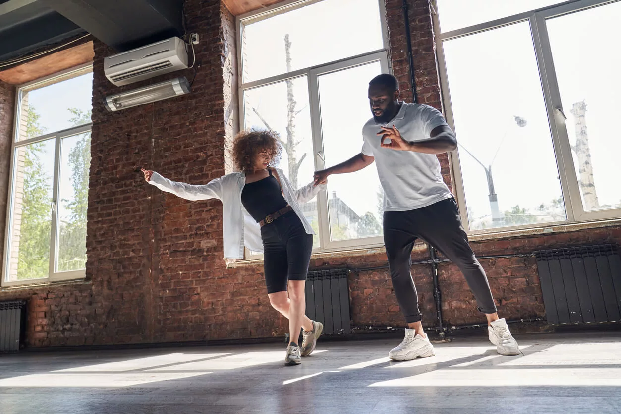 Two People Dancing In Dance Studio