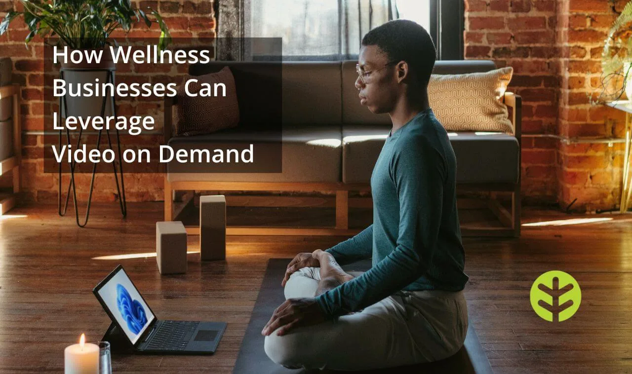 Man meditating in a class on his ipad in his living room.
