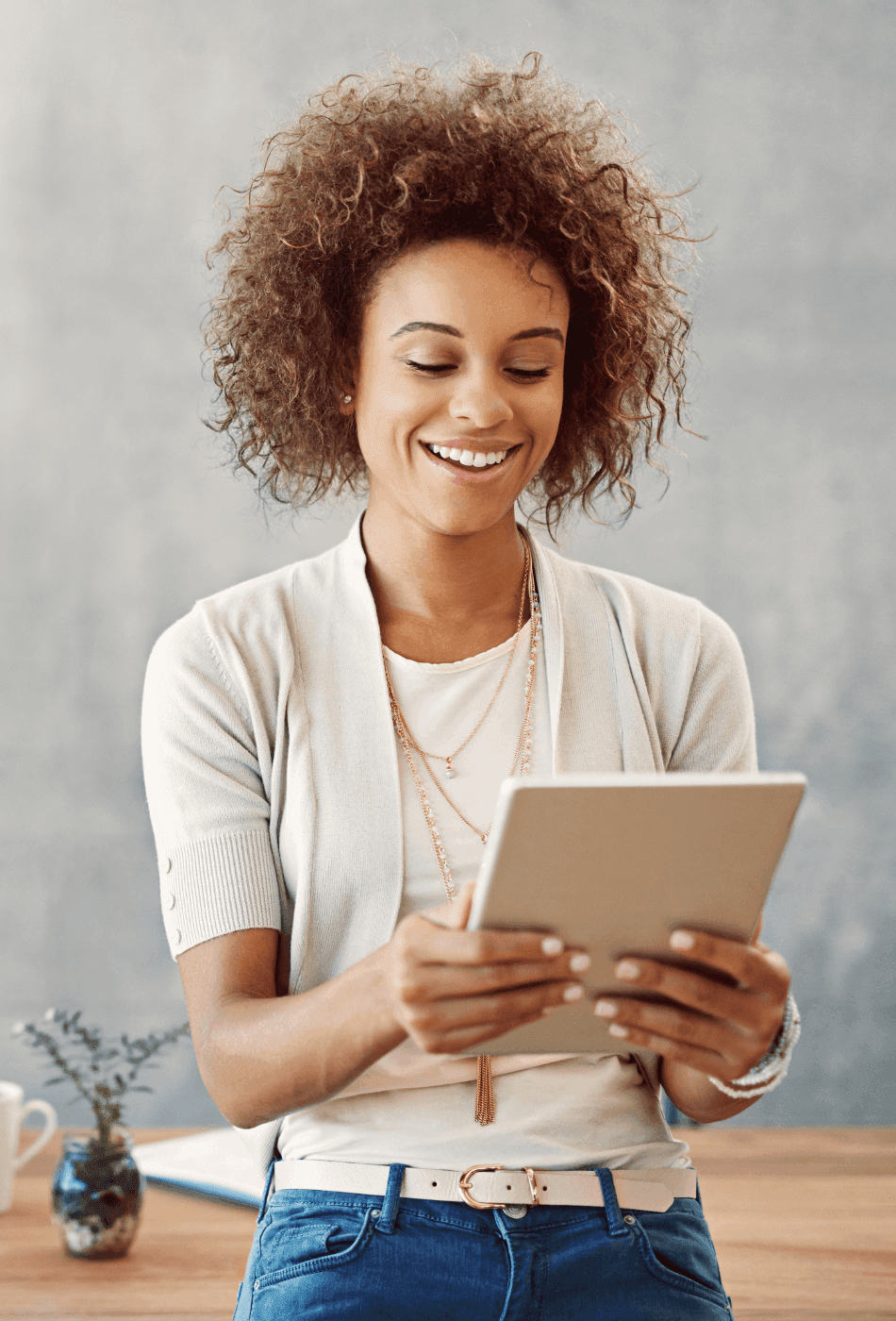 woman looking at her ipad viewing analytics and reporting tools and data