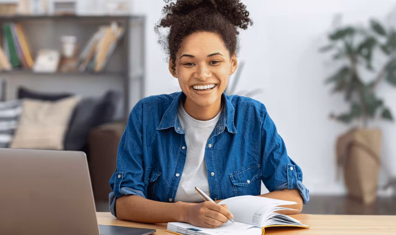 a woman practicing yoga from the side as she gets up into warrior one