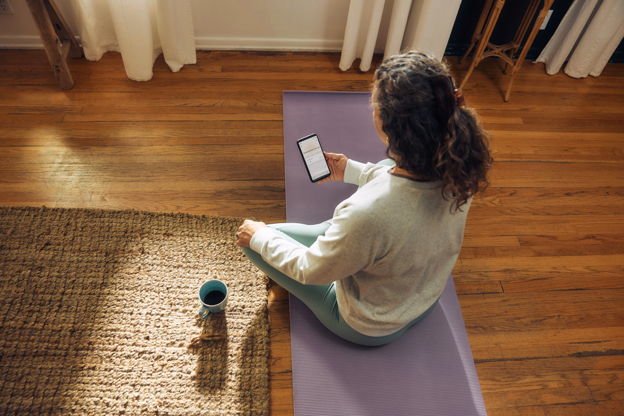 Person holding yoga phone app